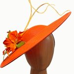 orange flowered fascinator hat
